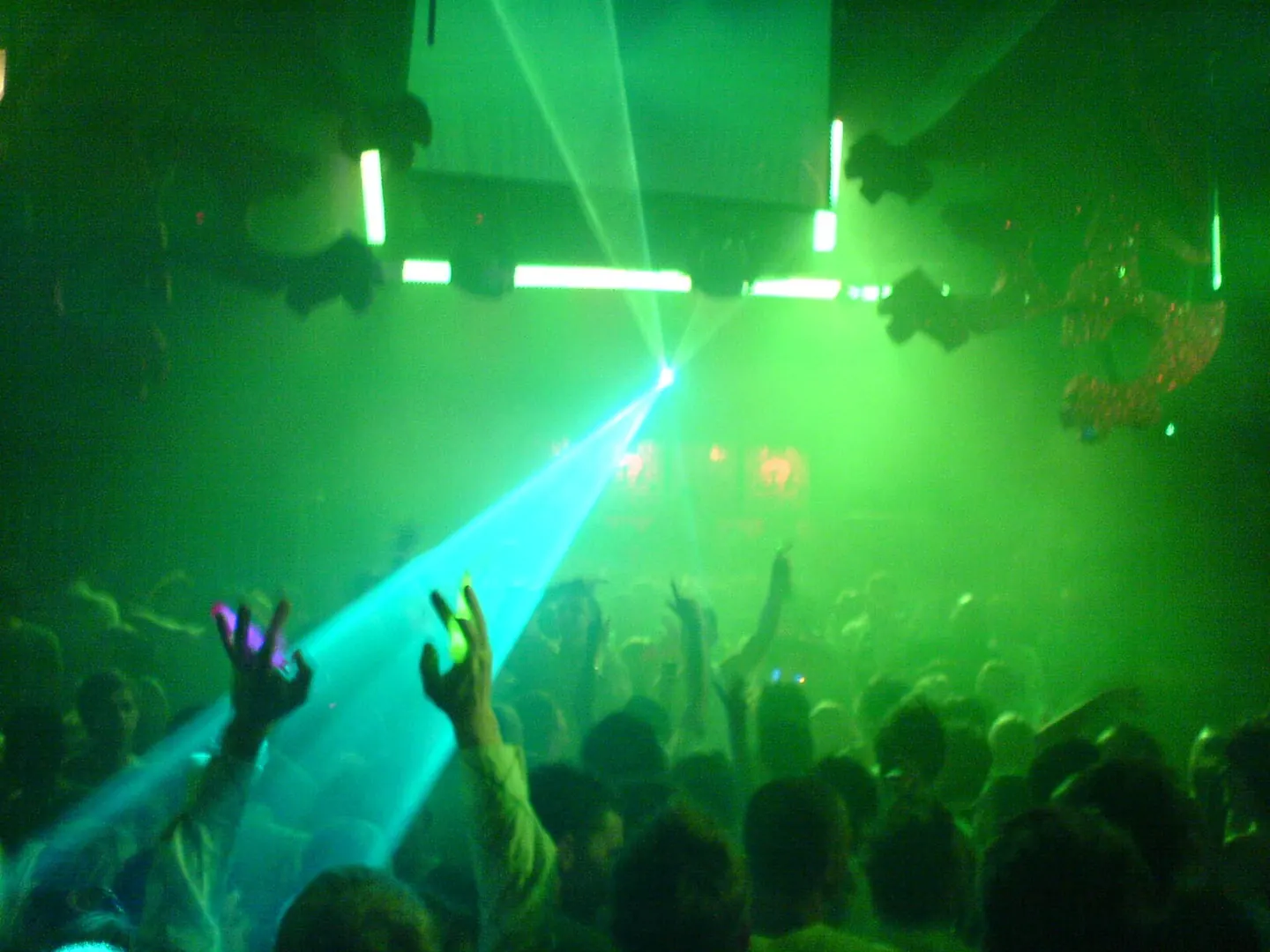 Green lasers and lighting above the dancefloor inside Gatecrasher in April 2006